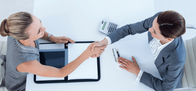 businesswomen shaking hands